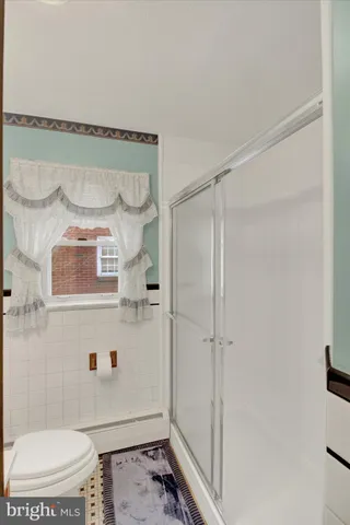 a room with a bed and a window