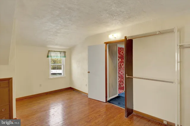 a bathroom with a sink mirror vanity and a shower