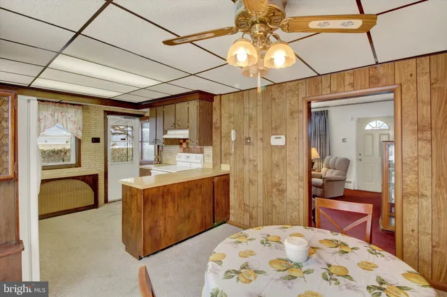 a kitchen with refrigerator and window