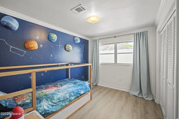 a bedroom with window