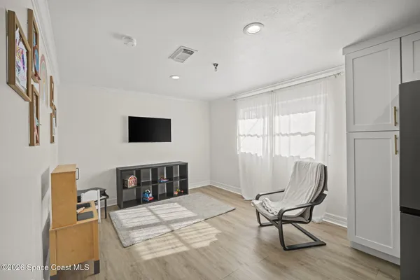 a bedroom with furniture and a window
