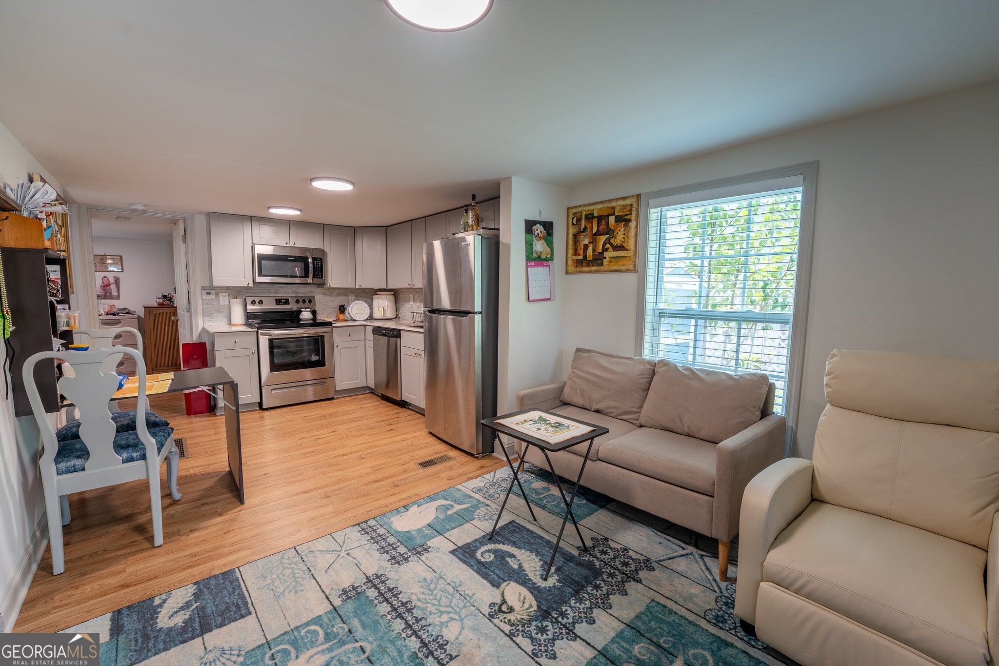 128 Branch Street Toccoa, GA 30577 - Photo 2 of 38 a living room with furniture and a kitchen view