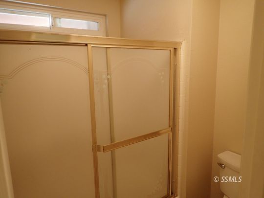 607 Plumblossom Court Ridgecrest, CA 93555 - Photo 17 of 28 a bathroom with a shower