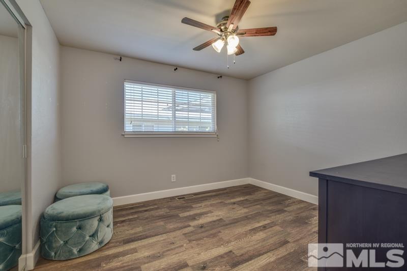 1450 Kirkham Way Reno, NV 89503 - Photo 13 of 20 a view of workspace with wooden floor fan and windows