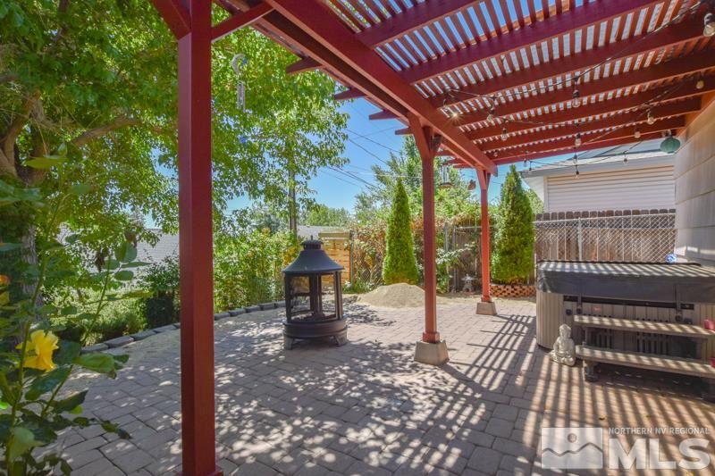 1450 Kirkham Way Reno, NV 89503 - Photo 18 of 20 a view of a patio with a table chairs and a backyard