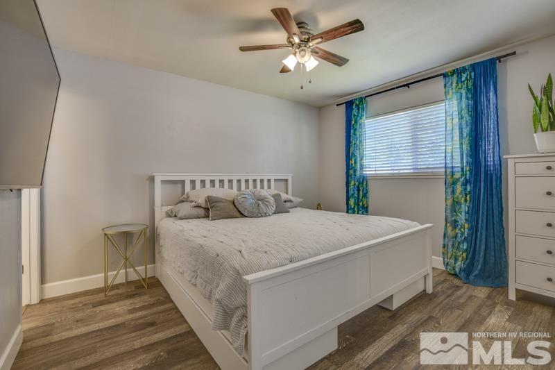 1450 Kirkham Way Reno, NV 89503 - Photo 10 of 20 a bed sitting in a bedroom next to a window
