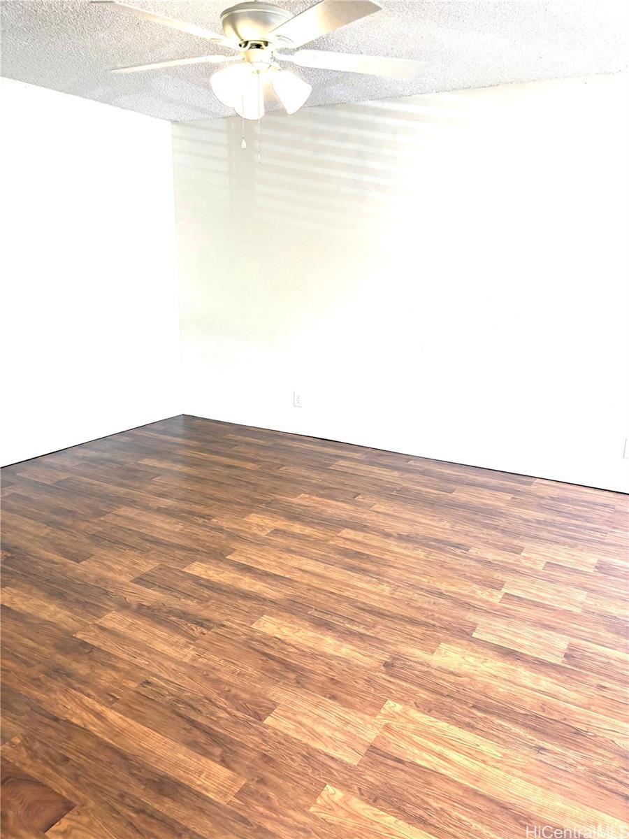 87-122 Helelua Street, Unit C204 Waianae, HI 96792 - Photo 9 of 14 a view of a room with wooden floor