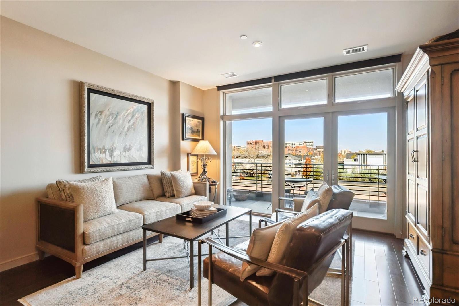 333 South Monroe Street, Unit 310 Denver, CO 80209 - Photo 12 of 33 a living room with furniture and a large window