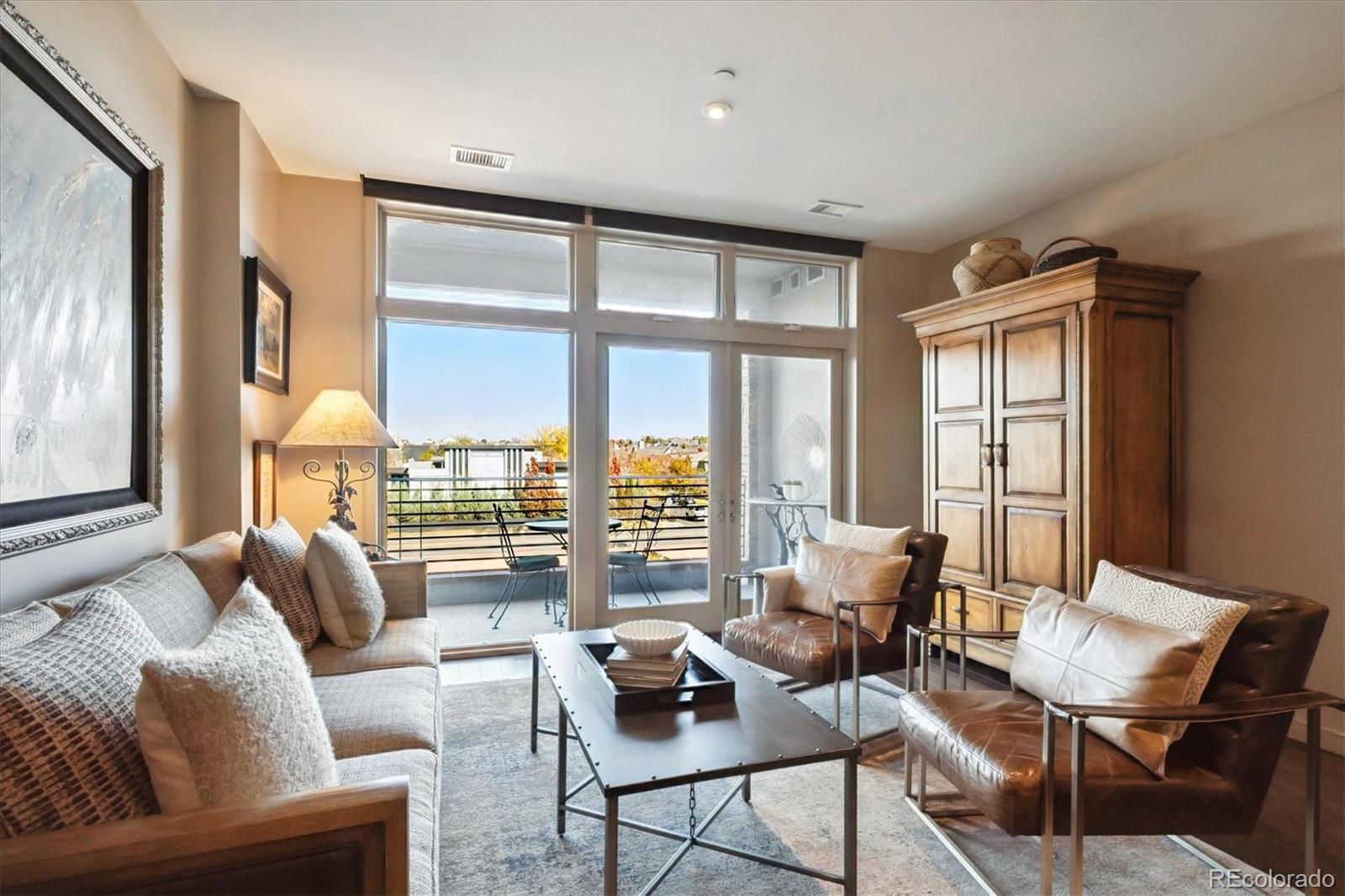 333 South Monroe Street, Unit 310 Denver, CO 80209 - Photo 13 of 33 a living room with furniture and a large window