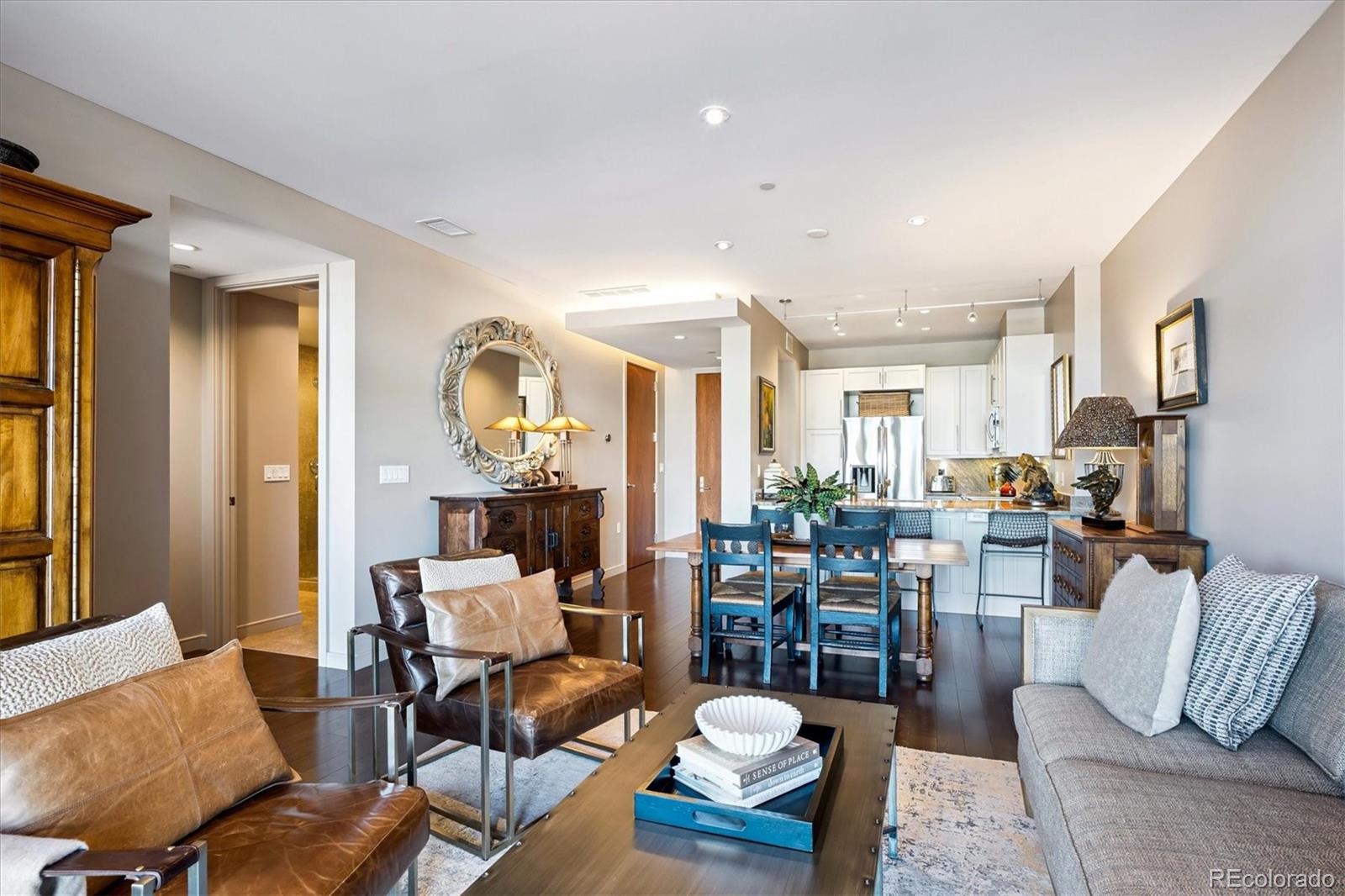 333 South Monroe Street, Unit 310 Denver, CO 80209 - Photo 14 of 33 a living room with furniture and wooden floor