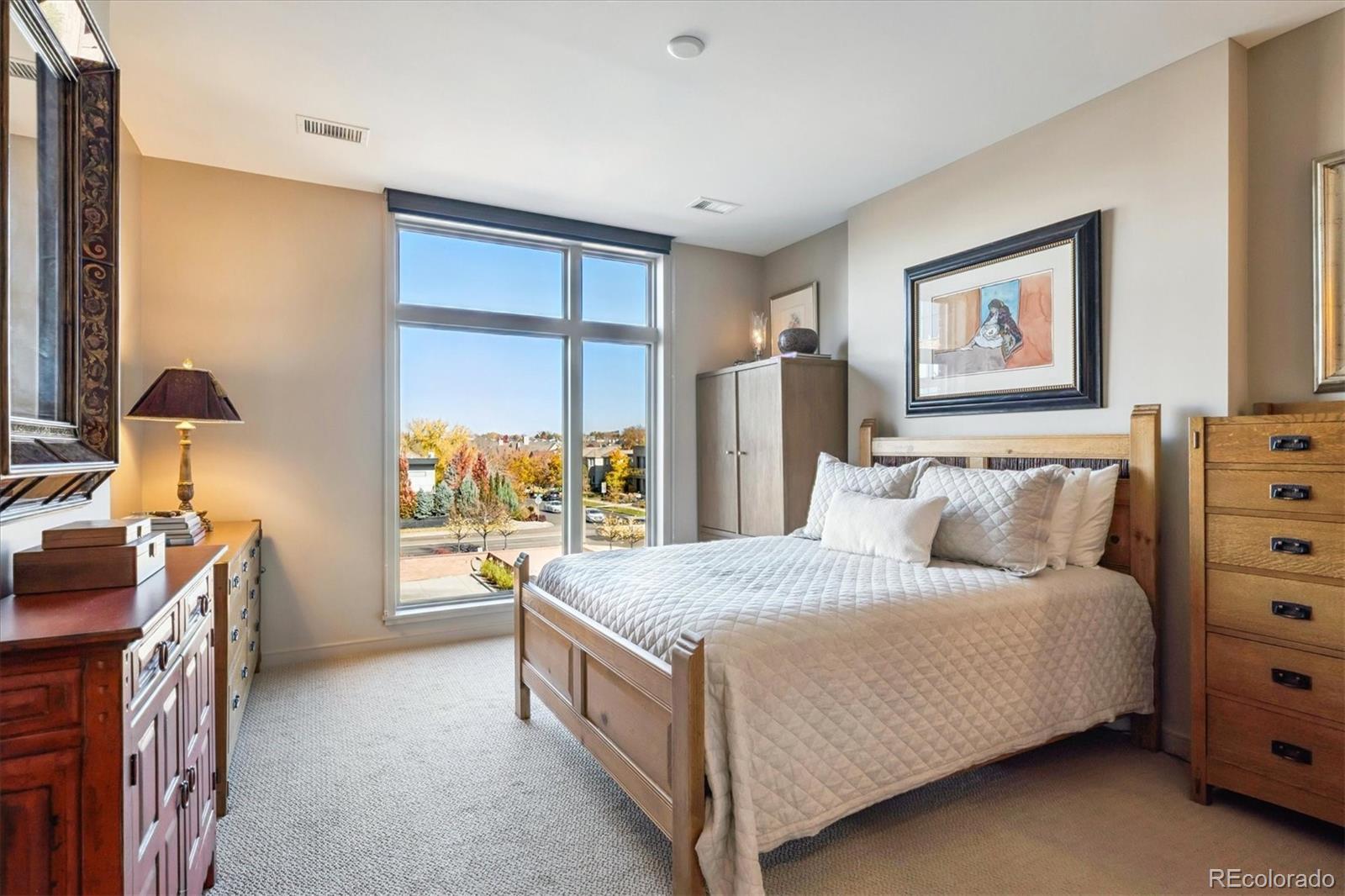 333 South Monroe Street, Unit 310 Denver, CO 80209 - Photo 17 of 33 a bedroom with a bed and a dresser