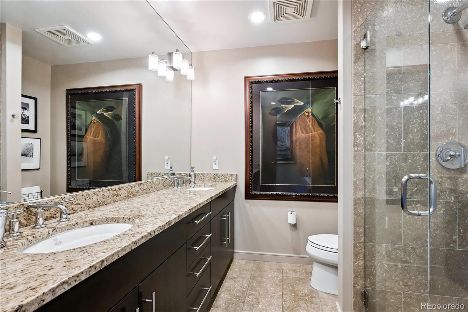 333 South Monroe Street, Unit 310 Denver, CO 80209 - Photo 18 of 33 a bathroom with a granite countertop sink mirror and a toilet