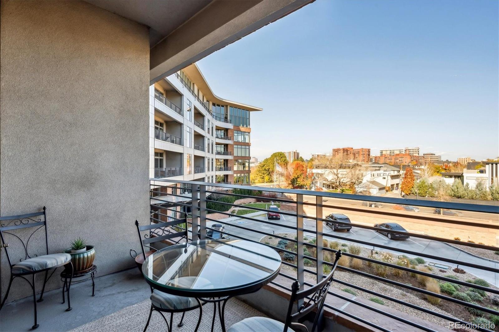 333 South Monroe Street, Unit 310 Denver, CO 80209 - Photo 21 of 33 a view of a balcony with chairs