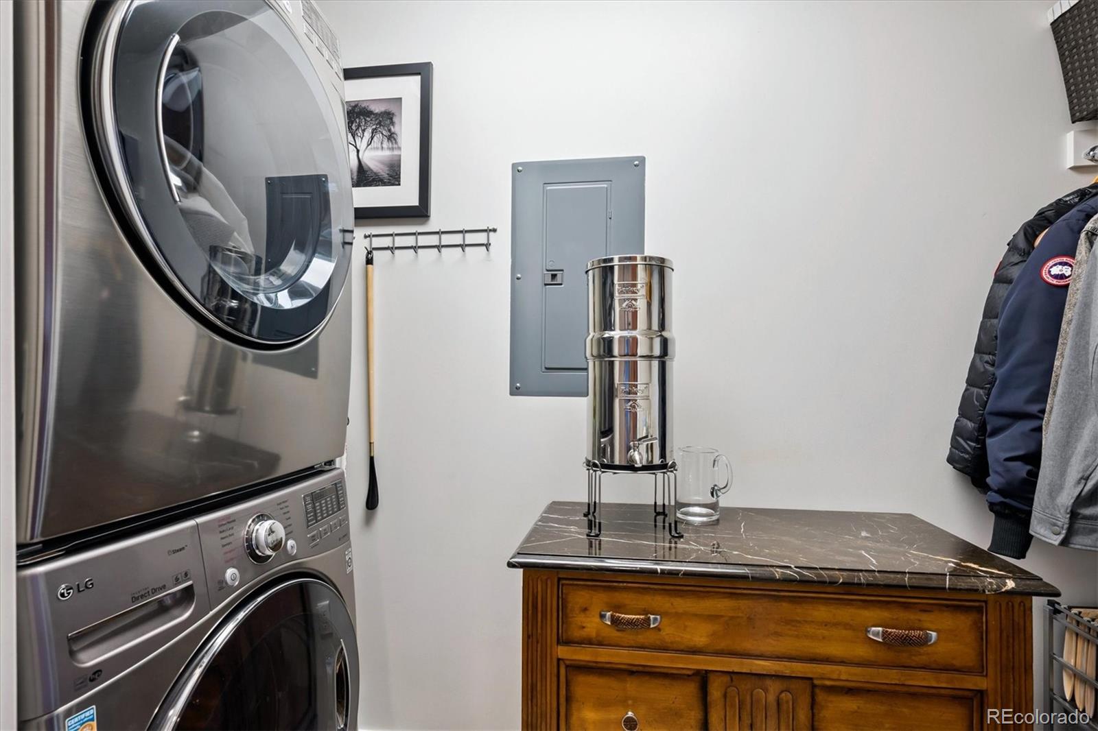 333 South Monroe Street, Unit 310 Denver, CO 80209 - Photo 23 of 33 a view of a livingroom with furniture and a mirror
