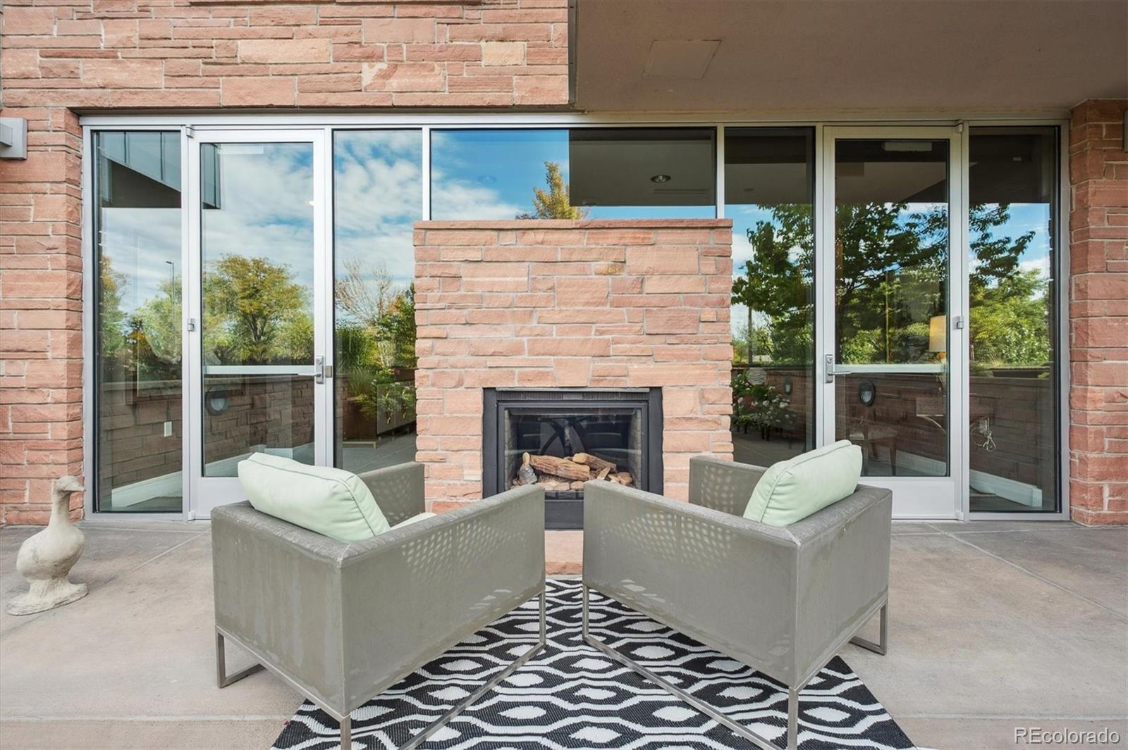 333 South Monroe Street, Unit 310 Denver, CO 80209 - Photo 28 of 33 a living room with furniture and a fireplace