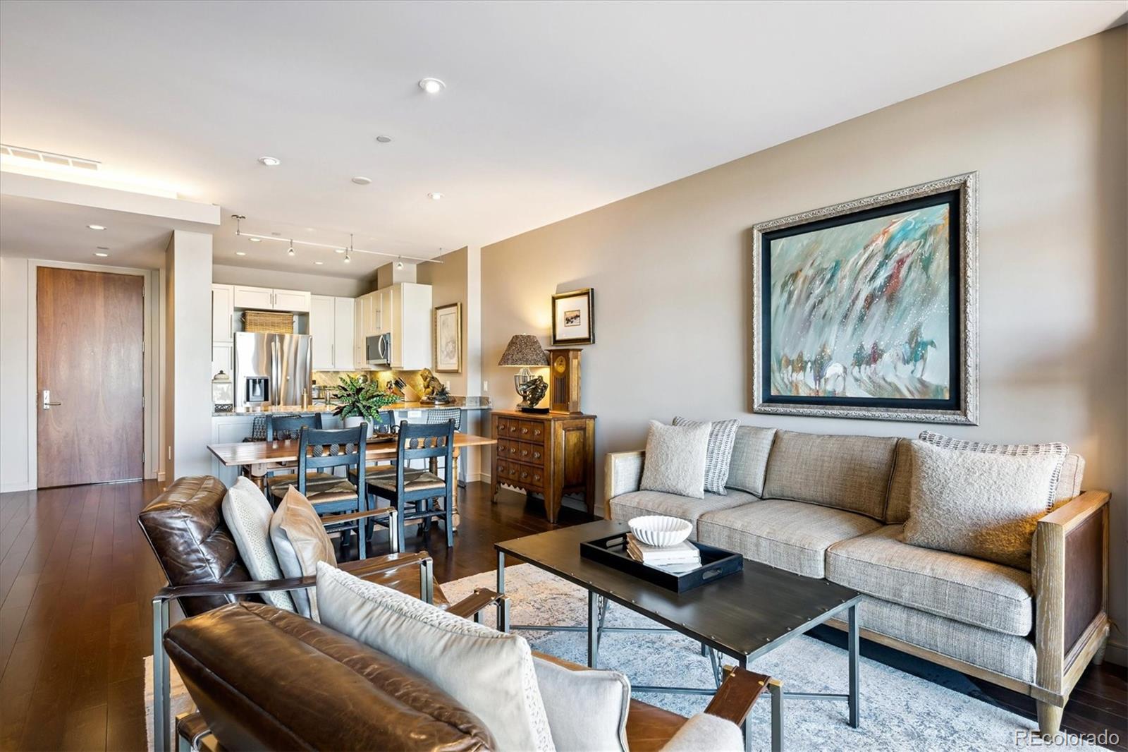 333 South Monroe Street, Unit 310 Denver, CO 80209 - Photo 6 of 33 a living room with furniture and wooden floor