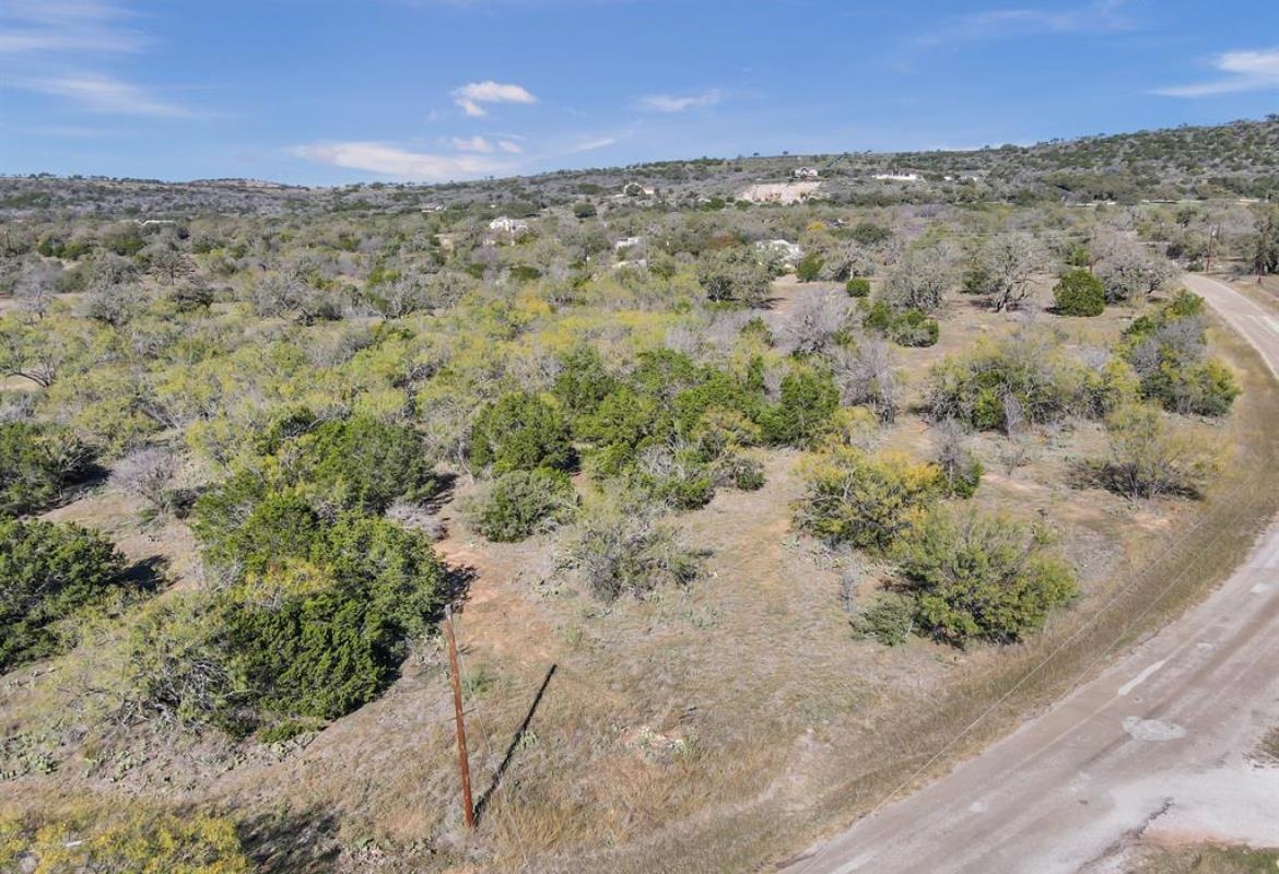 Oak Ridge Trail Kingsland, TX 78639 - Photo 6 of 7 a view of a yard with a dry yard
