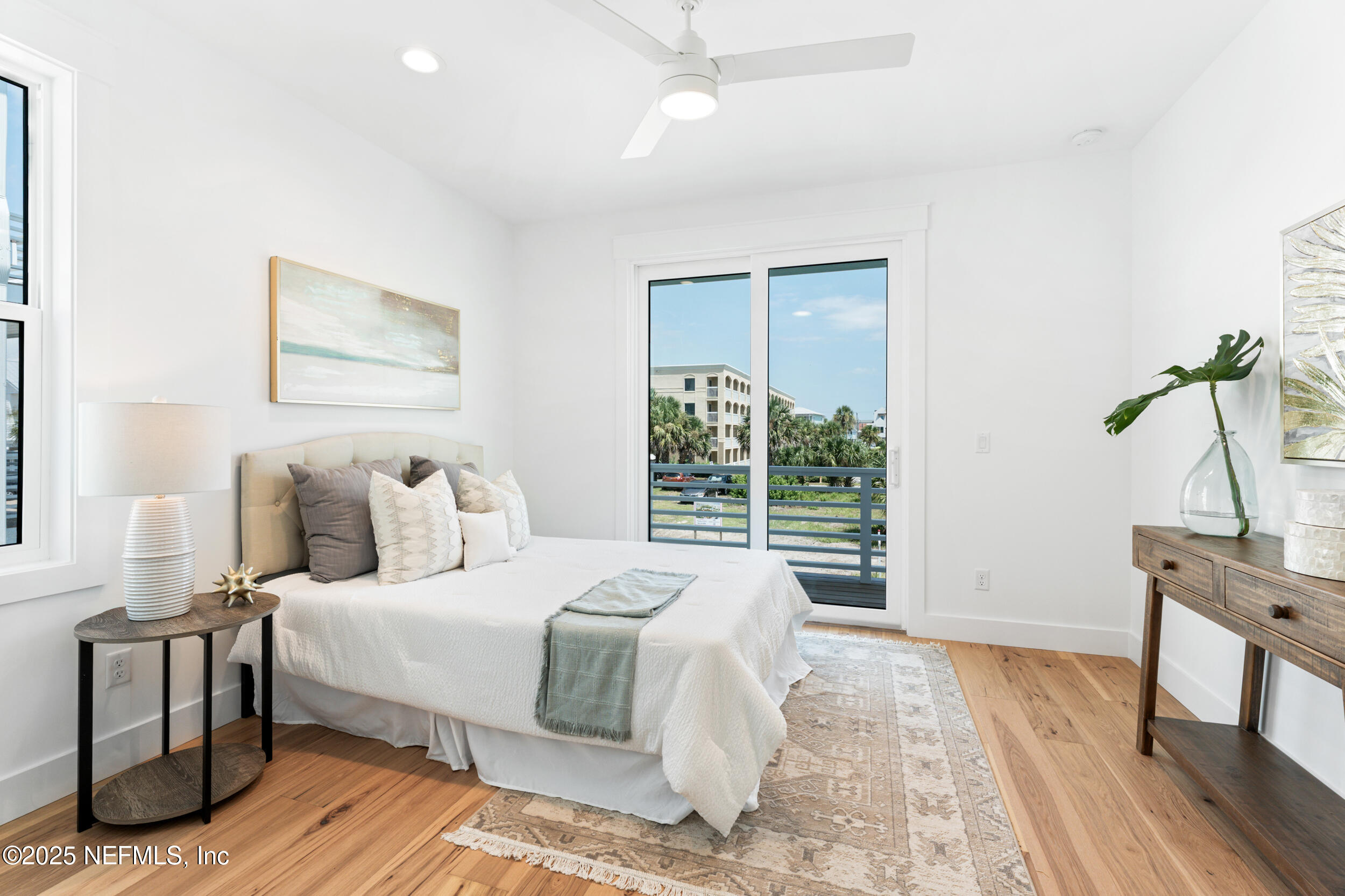 7 13th Street St. Augustine, FL 32080 - Photo 14 of 30 a bedroom with a bed wooden floor and window