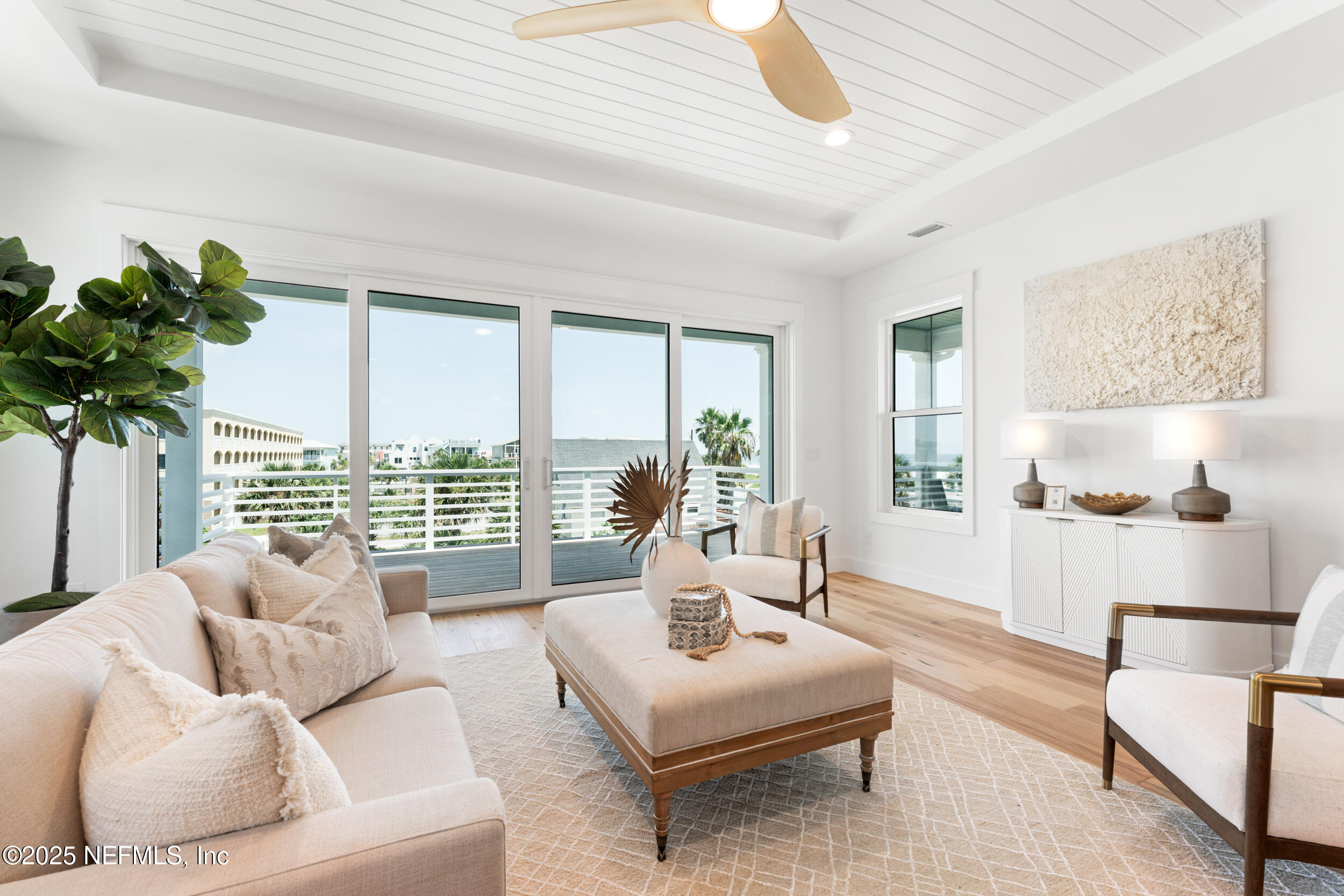 7 13th Street St. Augustine, FL 32080 - Photo 3 of 30 a living room with furniture and a large window with wooden floor