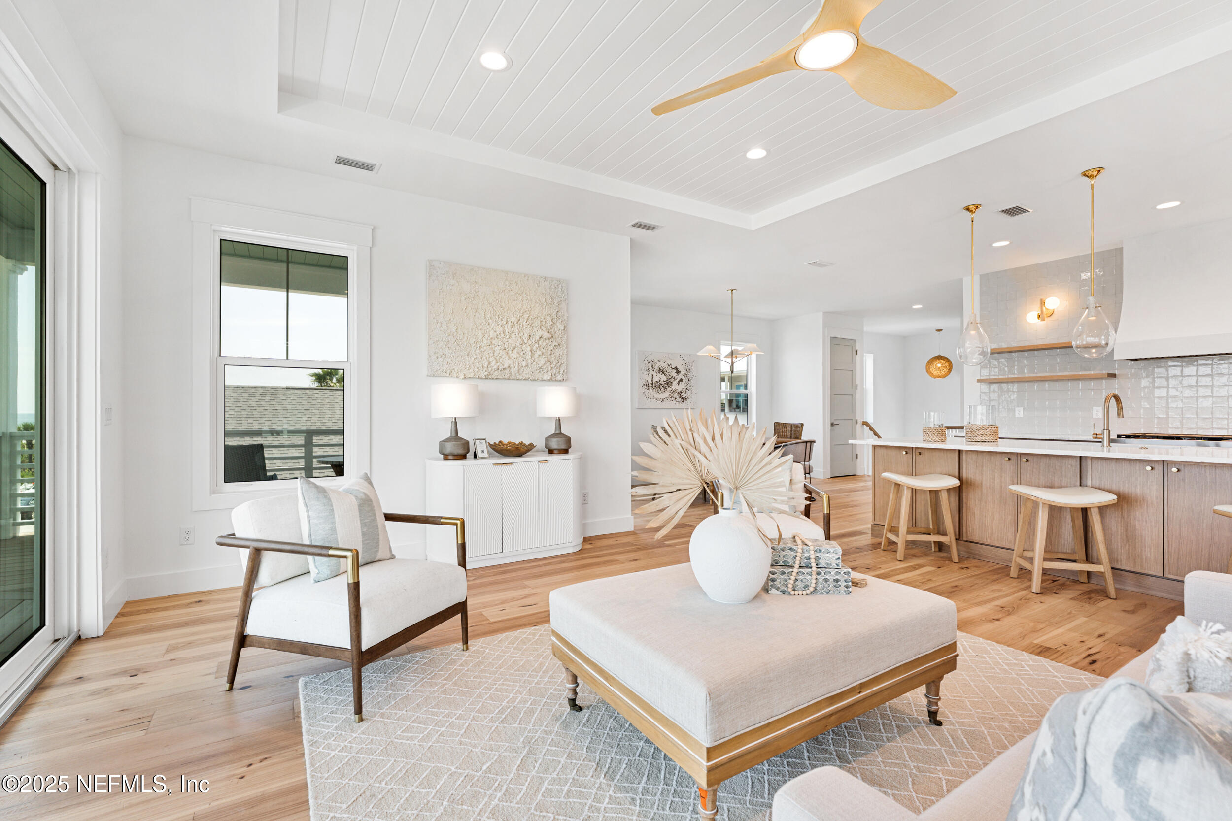 7 13th Street St. Augustine, FL 32080 - Photo 4 of 30 a living room with furniture a table and kitchen view