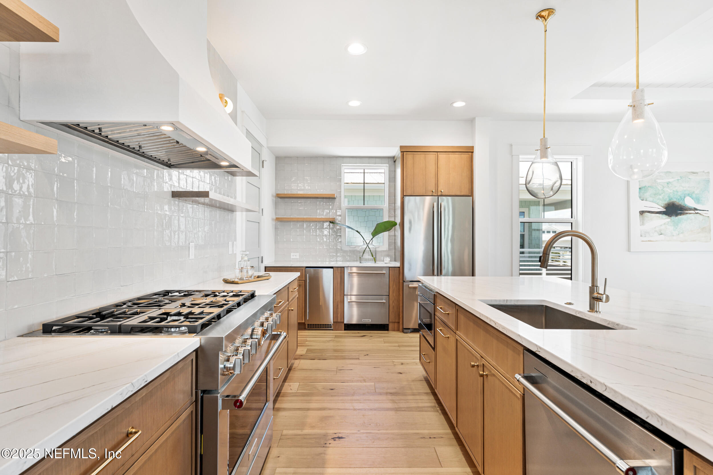 7 13th Street St. Augustine, FL 32080 - Photo 7 of 30 a kitchen with stainless steel appliances a sink stove and refrigerator
