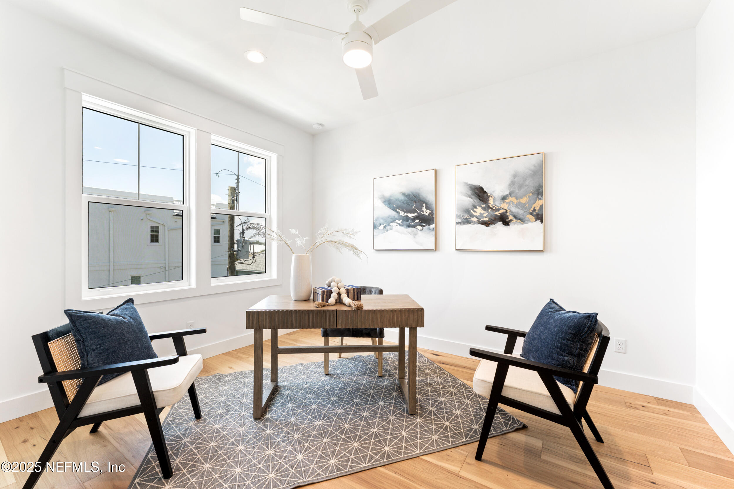 7 13th Street St. Augustine, FL 32080 - Photo 8 of 30 a view of a workspace room with furniture and wooden floor
