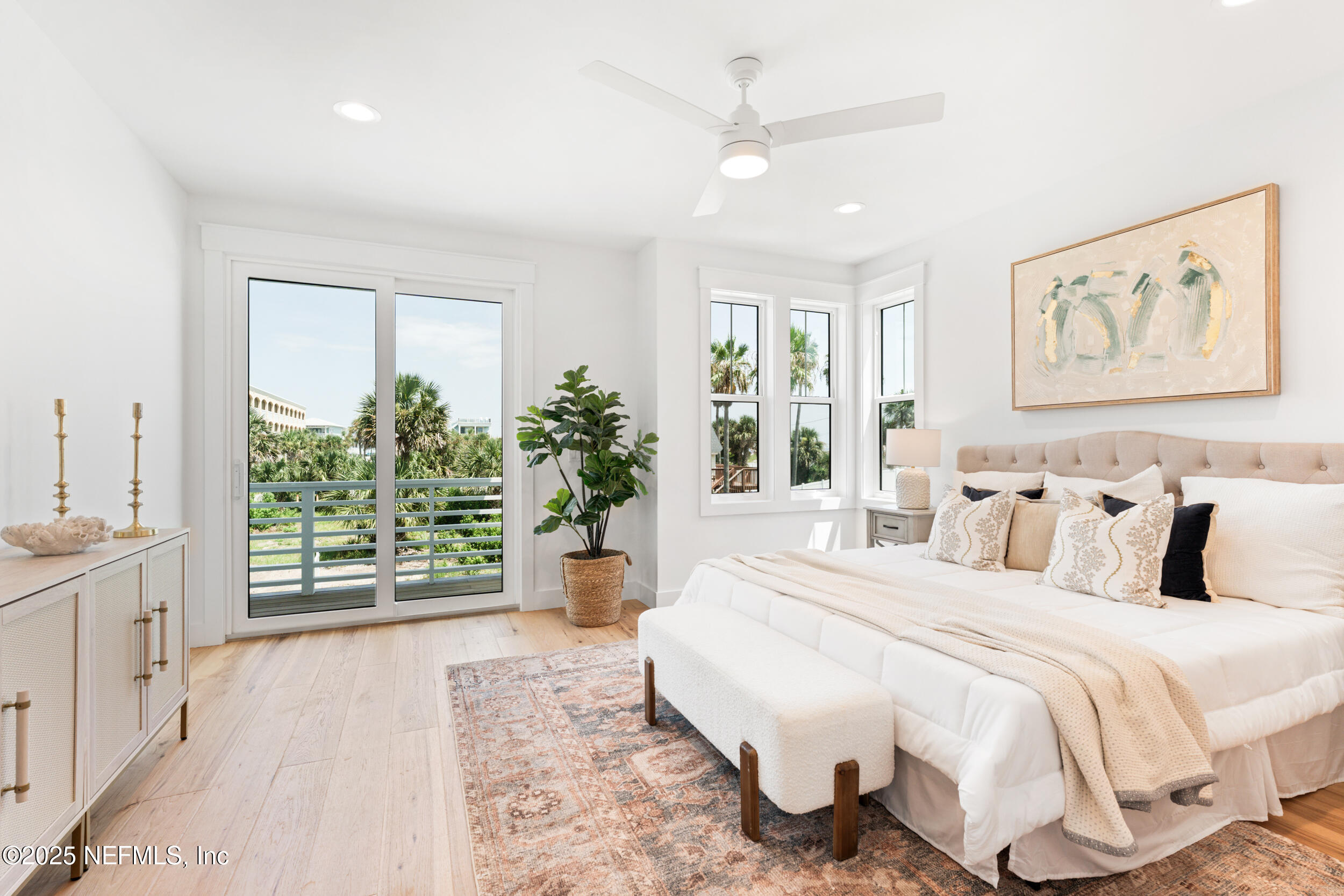 7 13th Street St. Augustine, FL 32080 - Photo 10 of 30 a spacious bedroom with a large bed and a large window