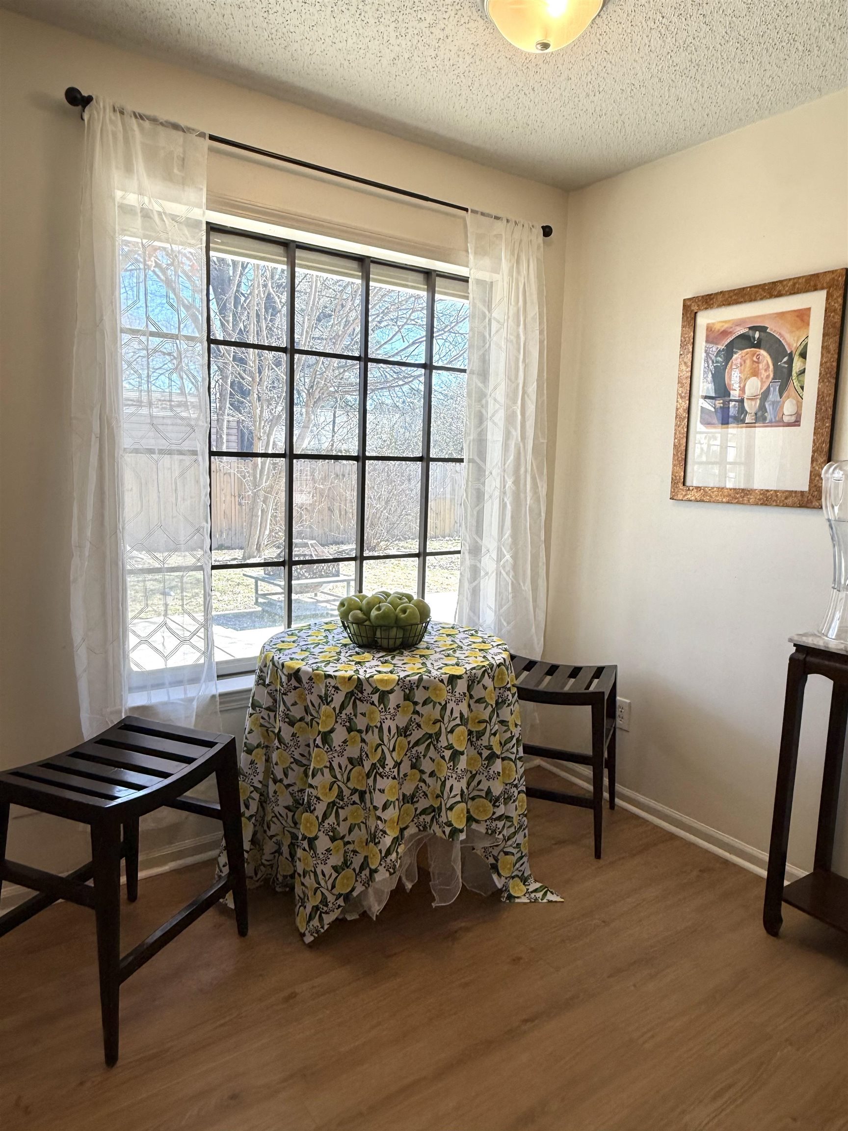 3204 Ruskin Road Memphis, TN 38134 - Photo 17 of 38 Dining room with a textured ceiling and dark wood-style floors