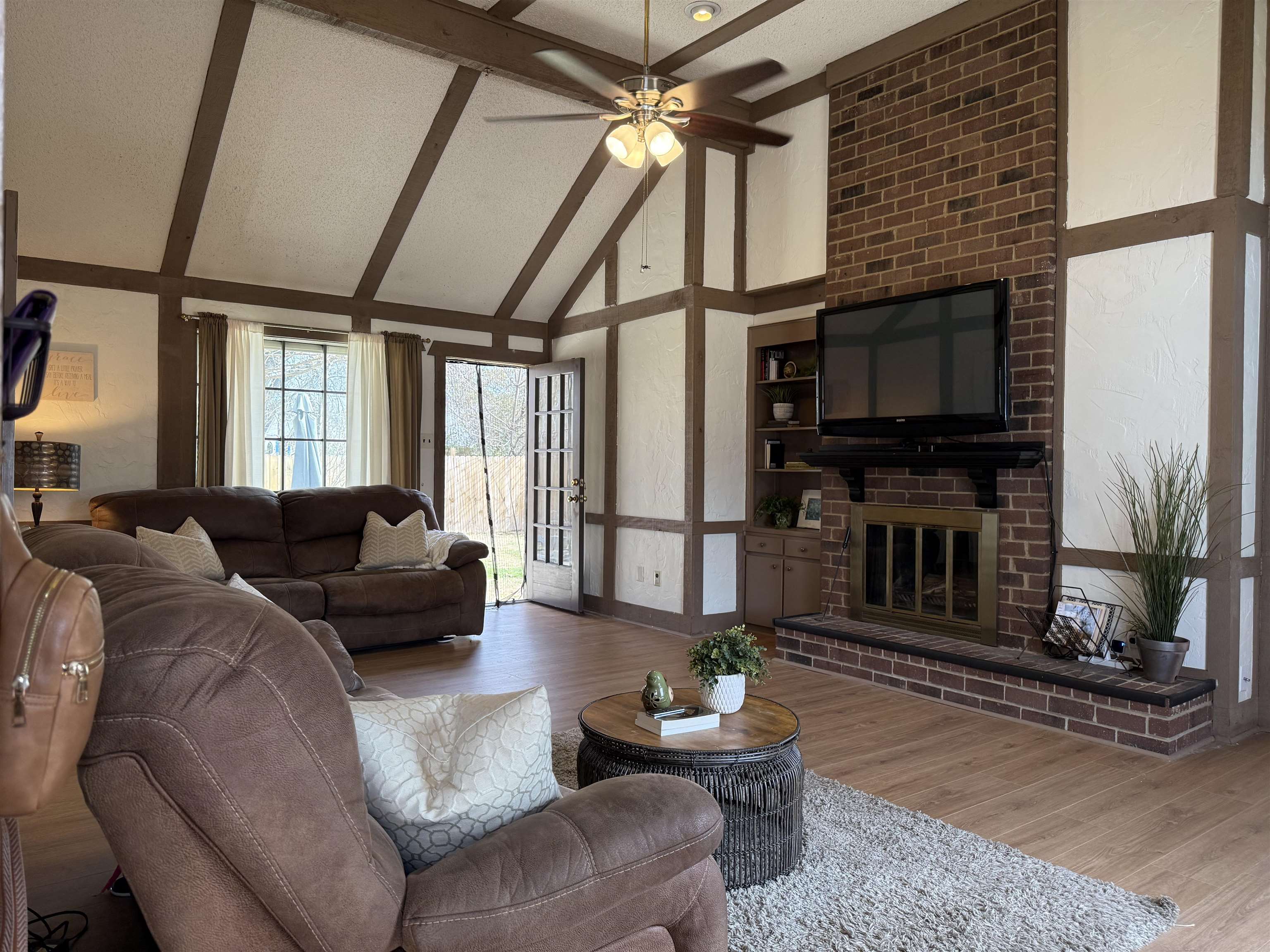 3204 Ruskin Road Memphis, TN 38134 - Photo 5 of 38 Living room with wood finished floors, a fireplace, lofted ceiling, and ceiling fan