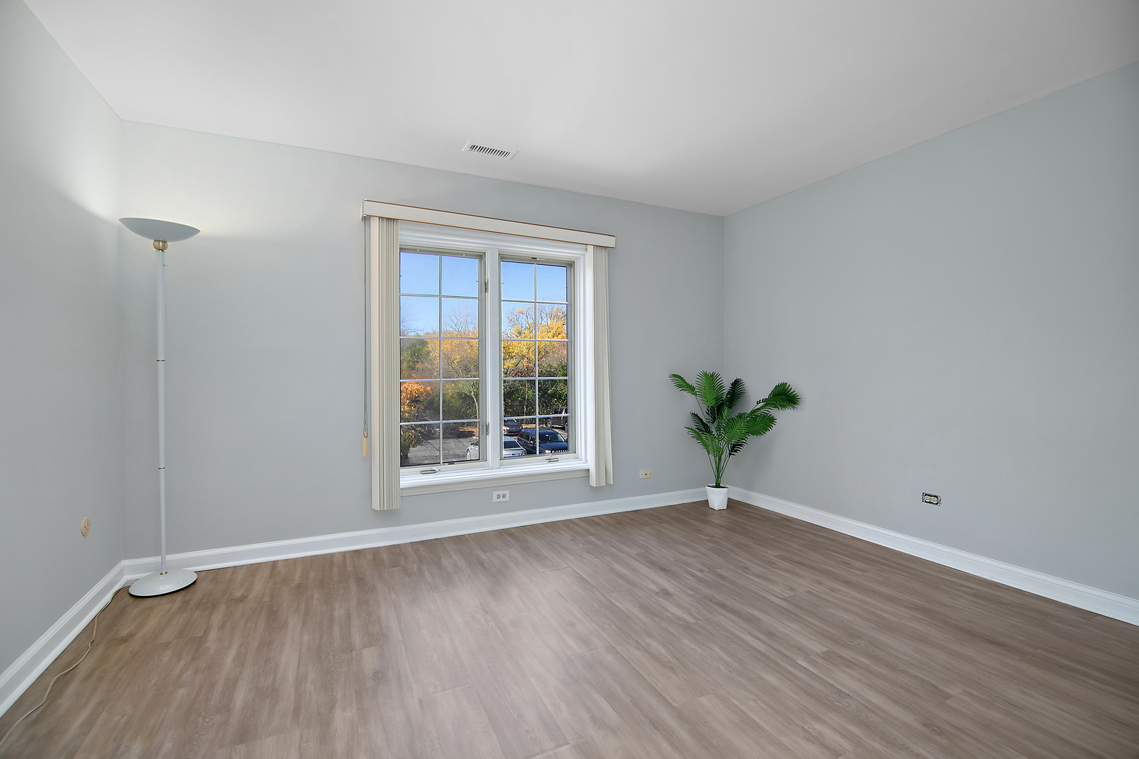 3427 Vollmer Road, Unit 202 Flossmoor, IL 60422 - Photo 14 of 27 a view of a room with wooden floor and a window
