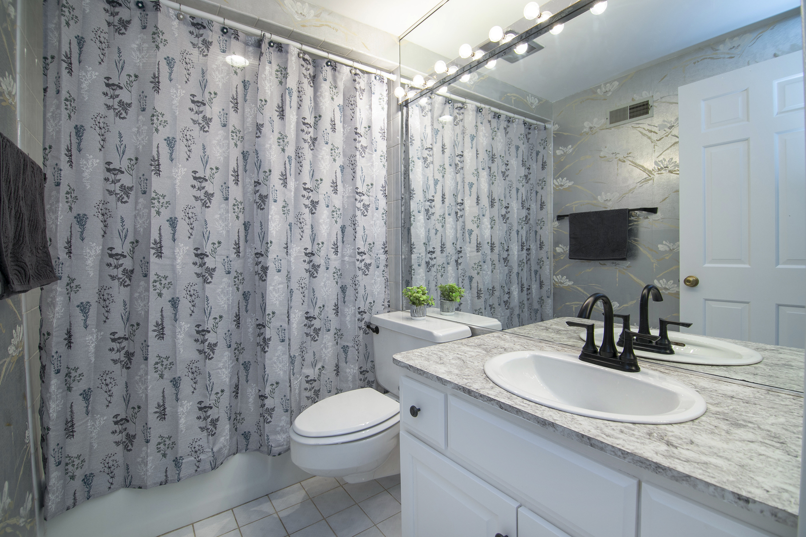 3427 Vollmer Road, Unit 202 Flossmoor, IL 60422 - Photo 15 of 27 a bathroom with a granite countertop sink a toilet and a mirror