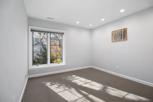 a view of a big room with windows