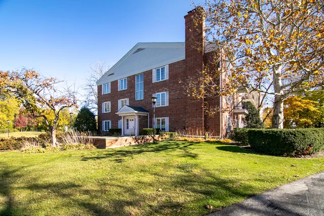 a view of a swimming pool with a house in the background