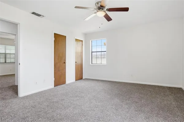 a view of empty room with windows