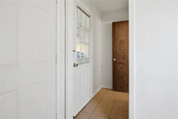 a view of a hallway with a wooden floor