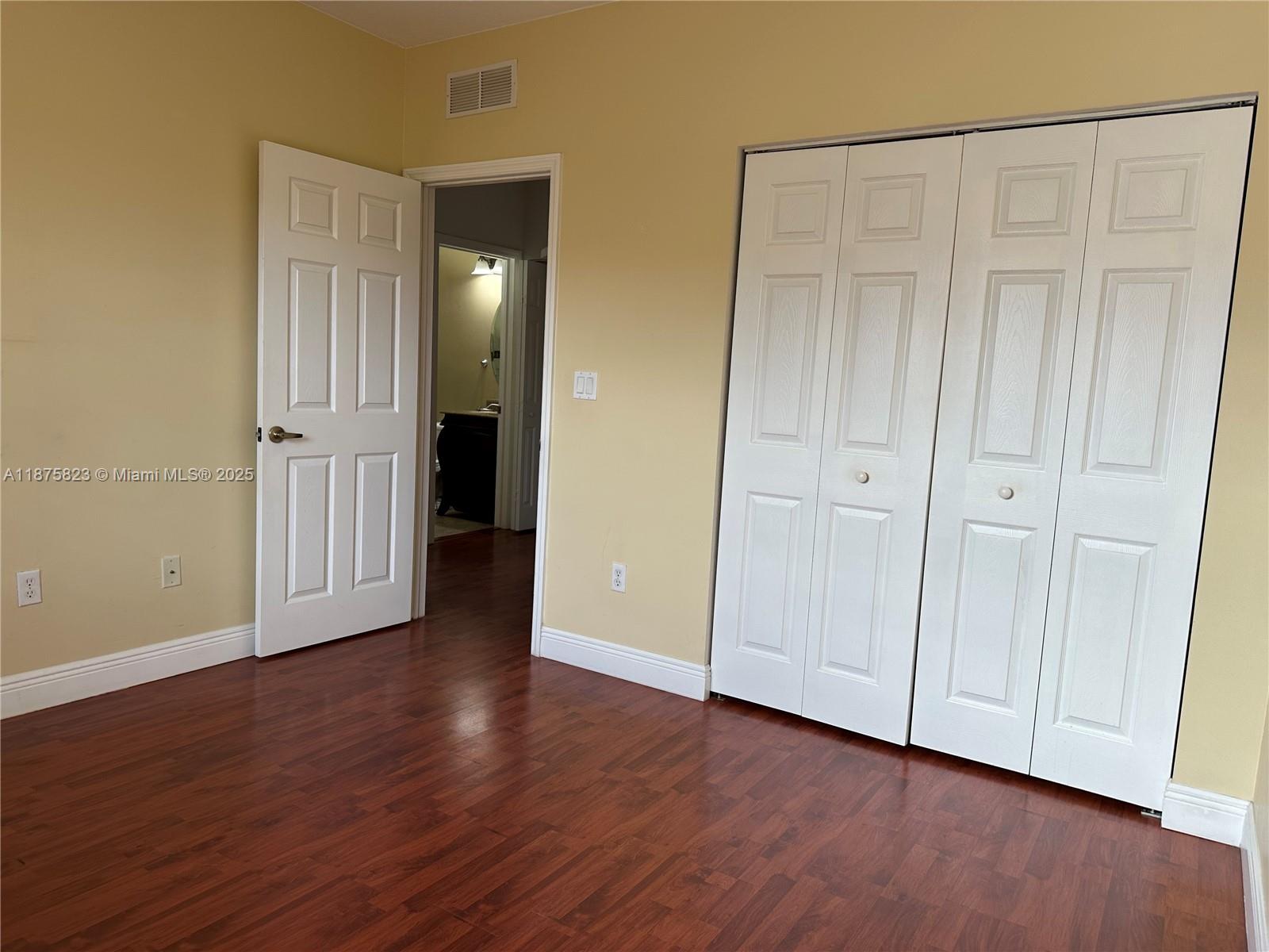 4959 Southwest 135th Way, Unit 4959 Miramar, FL 33027 - Photo 11 of 21 a view of an empty room with wooden floor