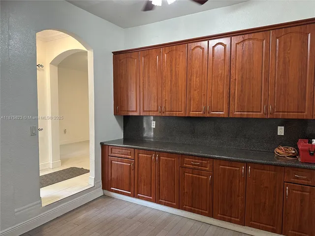 a view of a kitchen with appliances and cabinets