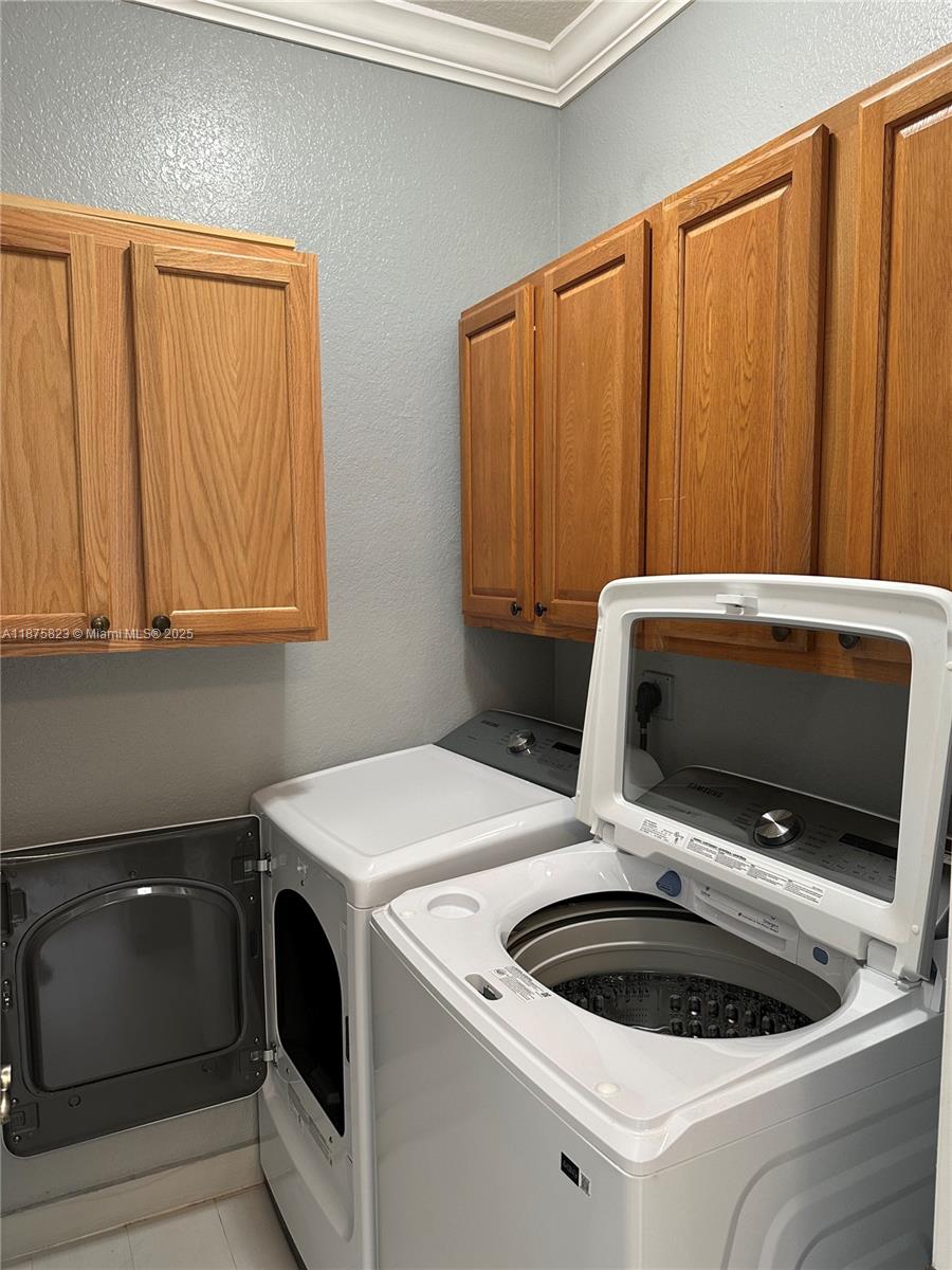 4959 Southwest 135th Way, Unit 4959 Miramar, FL 33027 - Photo 7 of 21 a utility room with dryer and washer