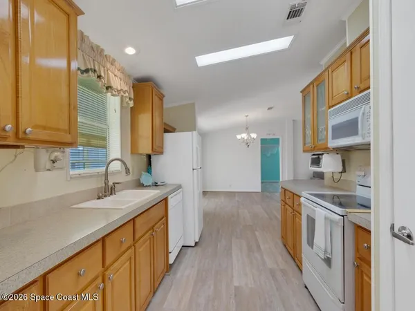 a view of roof deck with patio