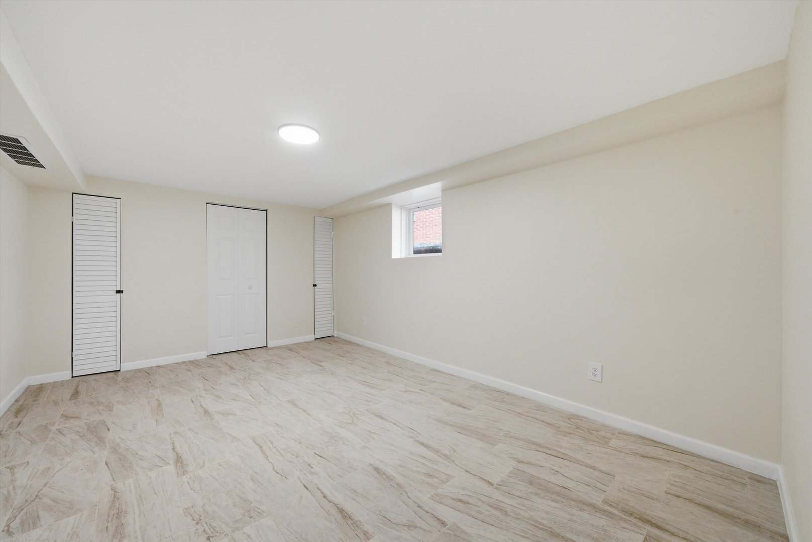 3907 West Marquette Road Chicago, IL 60629 - Photo 27 of 32 a view of an empty room with wooden floor