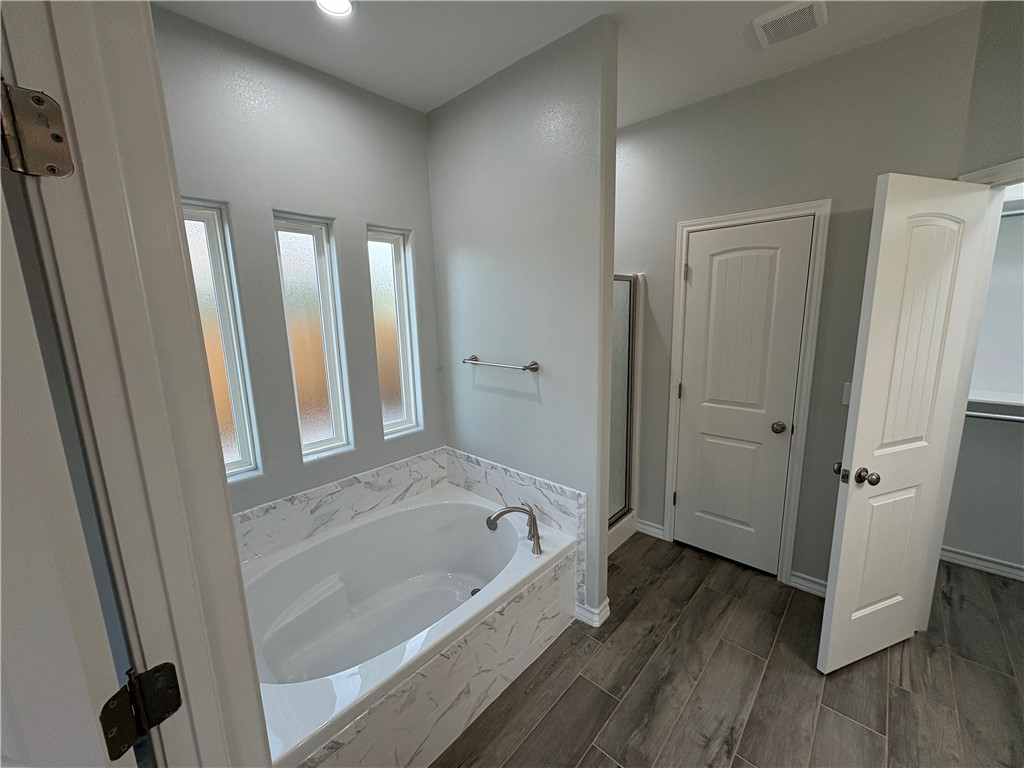 2533 Hewlett Ingleside, TX 78362 - Photo 13 of 23 a bathroom with a bathtub and a shower