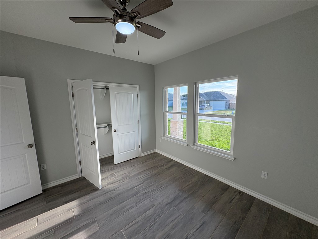 2533 Hewlett Ingleside, TX 78362 - Photo 18 of 23 a view of an empty room with a window and wooden floor