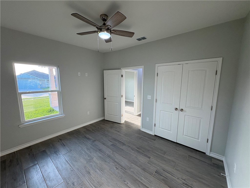 2533 Hewlett Ingleside, TX 78362 - Photo 19 of 23 an empty room with window and wooden floor