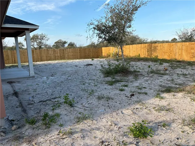 a view of backyard with green space
