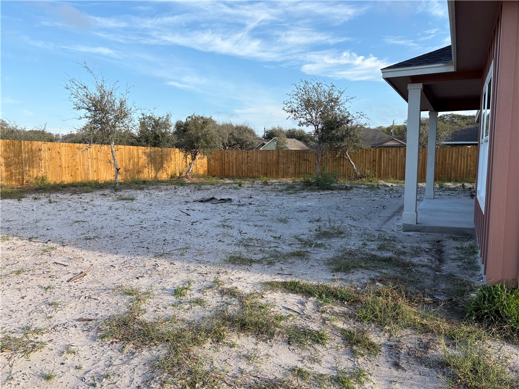 2533 Hewlett Ingleside, TX 78362 - Photo 22 of 23 a view of a dry yard with wooden fence