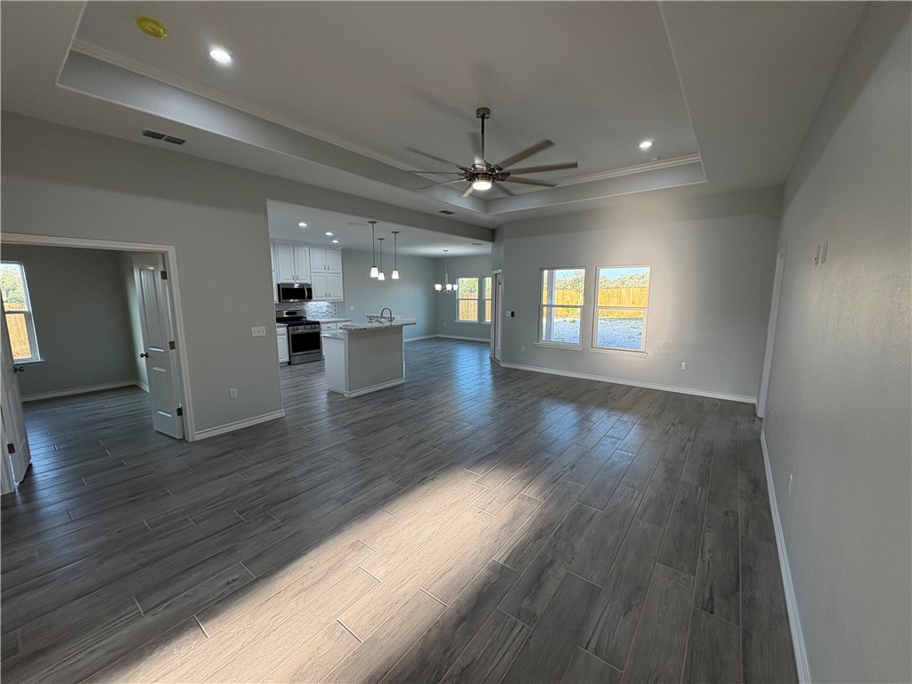 2533 Hewlett Ingleside, TX 78362 - Photo 4 of 23 an empty room with wooden floor and windows