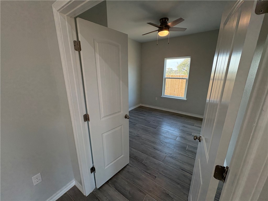 2533 Hewlett Ingleside, TX 78362 - Photo 9 of 23 wooden floor in an empty room with a window