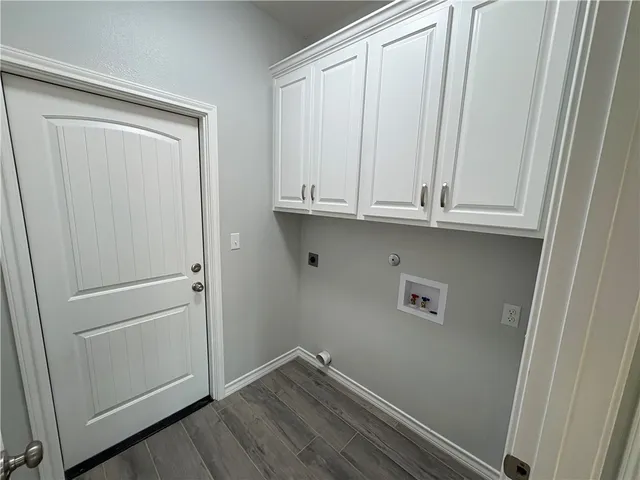 a view of cabinets and wooden floor