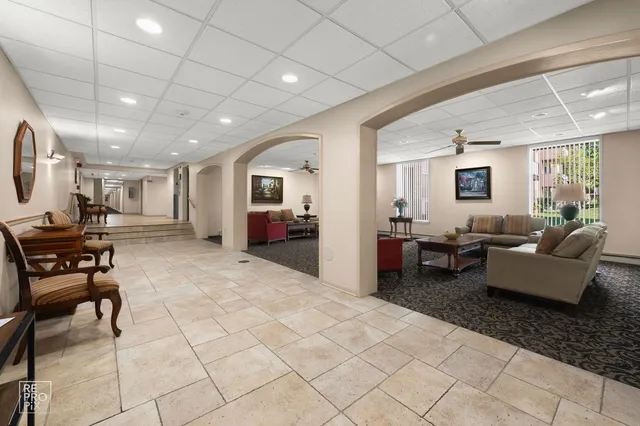 a living room with furniture and a table