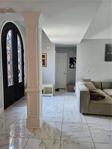 a view of livingroom with furniture and window